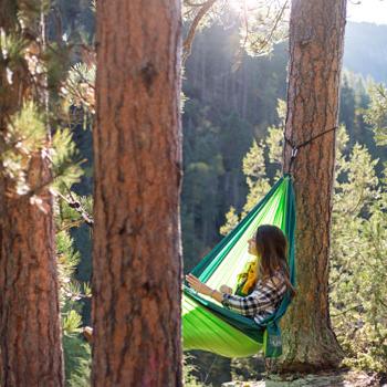 Girl overlooking Spearfish Canyon while hammocking.